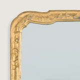 A 19th or early 20th century George II style gilt mirror.