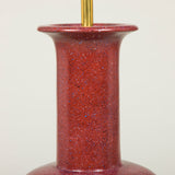 A small baluster shaped pottery vase with a painted faux porphyry finish, wired as a lamp.