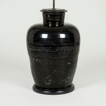 A pair of very large pottery lamps with a black glaze. Rewired.