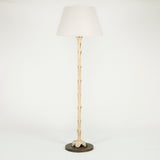 An early 20th C. floor lamp in the form of the trunk of a palm tree mounted on a round base. Rewired.
