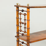 A set of walnut hanging shelves with bamboo-turned end supports circa 1890.