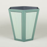 A hexagonal waste paper bin with hand painted faux panel decoration. Paint chart colour No. 3.