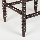 A small 19th century bobbin-turned stool or table, the top probably later than the base.