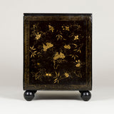 A square Chinese export lacquer box. Sliding lid and gilt decoration. Early 19th century, later ball feet.
