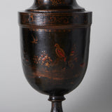 A pair of 19th century turned wooden urns and covers with black red and gilt japanned Chinoiserie decoration.