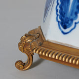 A blue and white faience vase and cover, 18th or early 19th C, with ormolu mounts, wired as a lamp.
