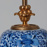 A blue and white faience vase and cover, 18th or early 19th C, with ormolu mounts, wired as a lamp.