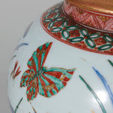 A polychrome vase decorated with flowers and butterflies, Japanese, c.1880, wired as a lamp.