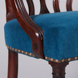A George III mahogany elbow chair with serpentine top rail and back splats, circa 1760.