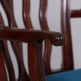 A George III mahogany elbow chair with serpentine top rail and back splats, circa 1760.