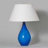 An early 20th century blue glass bottle neck lamp, circa 1930.