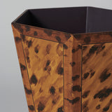 A hexagonal waste paper bin with hand painted faux panel decoration. Tortoiseshell.