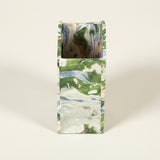A fine cartonnage pencil holder decorated in marbleised and small scale patterned papers.