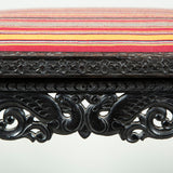 A 19th century Celonese intricately carved ebony rectangular stool with a drop-in seat.