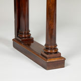 An early 19th century mahogany console/serving table with simple column supports and good colour and patination.