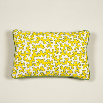 A needlepoint panel of Squiggle in citron made up as a cushion with green wool backing.