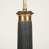 An early 19th century French black tole and brass column lamp of good size, the fluted column on a square plinth base. Circa 1830, original paint. Rewired.