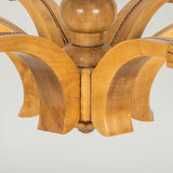 A mid 20th century French Walnut chandelier with six splayed tapering arms and a central bobbin stem, rewired.