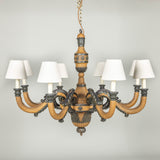 A carved and painted wooded eight arm chandelier, French Empire period. Circa 1810, wired for electricity.