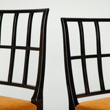 A set of four ebonised side chairs with lattice backs, second half 20th century. A matching pair to the same model but slightly taller also available.