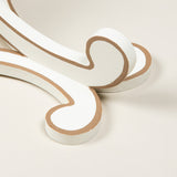 A SIMPLE PAINTED WOODEN WALL BRACKET WITH ADDED LINE DETAIL