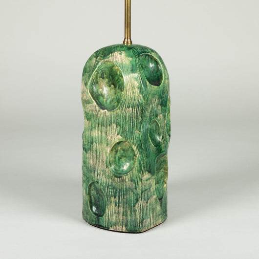 A green studio pottery vase with large dimples, wired as a lamp.