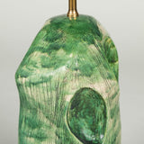 A green studio pottery vase with large dimples, wired as a lamp.