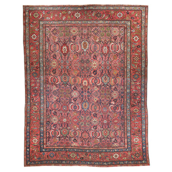 A RARE ANTIQUE HAMADAN CARPET, THE INTRICATE RED, AUBERGINE AND BLUE FLORAL DESIGN IS LAID ON A FINE WEAVE RASPBERRY COLOURED GROUND. WOVEN BETWEEN 1860-1870 IN NW PERSIA.