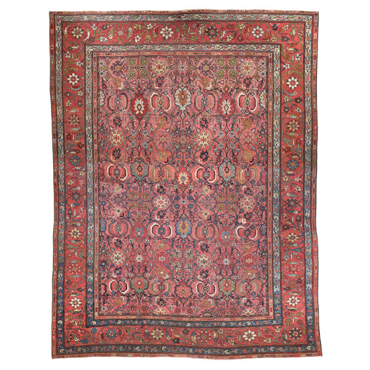 A RARE ANTIQUE HAMADAN CARPET, THE INTRICATE RED, AUBERGINE AND BLUE FLORAL DESIGN IS LAID ON A FINE WEAVE RASPBERRY COLOURED GROUND. WOVEN BETWEEN 1860-1870 IN NW PERSIA.