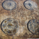 A 1960s/1970s SPANISH SIDE TABLE WITH A GILT METAL BASE AND LATER PAINTED DECORATION TO THE TOP.