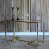 A 1970S ITALIAN BRASS CONSOLE TABLE WITH INSET GLASS TOP, IN THE MANNER OF WILLY RIZZO.