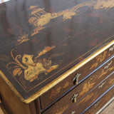 A LATE 19TH CENTURY CONTINENTAL FOUR DRAWER JAPANNED COMMODE WITH CHINOISERIE DECORATION, BRACKET FEET AND DROP HANDLES.