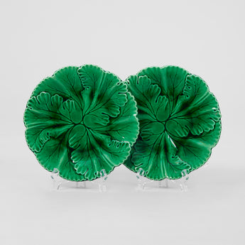 A SET OF SIX EARLY 20TH CENTURY FRENCH GREEN GLAZED LEAF PLATES.