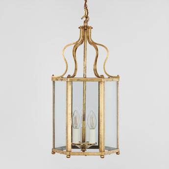 A MID-20TH CENTURY HEXAGONAL BRASS HANGING LANTERN WITH AN OGEE SHAPED TOP SECTION. REWIRED.
