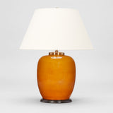 AN EARLY 20TH CENTURY CHINESE VASE IN A DEEP YELLOW GLAZE WIRED AS A LAMP.