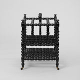 AN EBONISED BOBBIN-TURNED CANTERBURY, LATE 19TH C. ENGLISH.