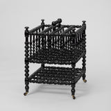 AN EBONISED BOBBIN-TURNED CANTERBURY, LATE 19TH C. ENGLISH.