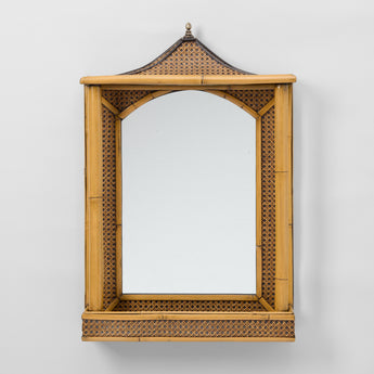 A MID 20THC BAMBOO AND RATTAN MIRROR WITH A PAGODA SHAPED TOP AND INTEGRAL SHELF TO THE BASE