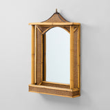 A MID 20THC BAMBOO AND RATTAN MIRROR WITH A PAGODA SHAPED TOP AND INTEGRAL SHELF TO THE BASE