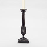 A PAIR OF ANGLO-INDIAN HARDWOOD CANDLESTICKS WITH GADROONING TO THE TOP AND BASE AND A STYLISED TULIP CUP TO THE BASE OF THE TAPERING STEM. WIRED A LAMPS.