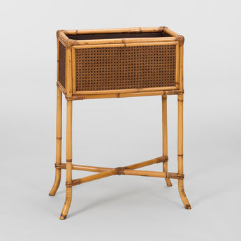 A MID-20TH C. RECTANGULAR BAMBOO AND RATTAN PLANT STAND.
