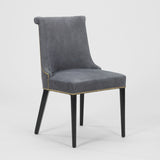 A PAIR OF EARLY TO MID-20TH CENTURY SIDE CHAIRS WITH A SCROLL BACK AND EBONISED LEGS, REUPHOLSTERED IN A BLUE GRAY LEATHER.