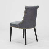 A PAIR OF EARLY TO MID-20TH CENTURY SIDE CHAIRS WITH A SCROLL BACK AND EBONISED LEGS, REUPHOLSTERED IN A BLUE GRAY LEATHER.