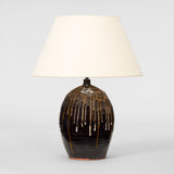 A LARGE VASE LAMP IN A DARK BROWN GLAZE WITH DRIP DECORATION TO THE UPPER SECTION, LATE 20TH CENTURY.