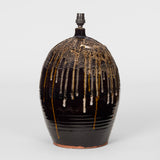 A LARGE VASE LAMP IN A DARK BROWN GLAZE WITH DRIP DECORATION TO THE UPPER SECTION, LATE 20TH CENTURY.