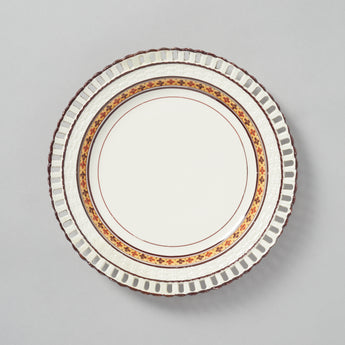 A CREAMWARE STAFFORDSHIRE PLATE WITH BASKETWEAVE BORDER AND A BAND OF FLOWER HEAD DECORATION, CIRCA 1810.