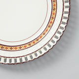 A CREAMWARE STAFFORDSHIRE PLATE WITH BASKETWEAVE BORDER AND A BAND OF FLOWER HEAD DECORATION, CIRCA 1810.
