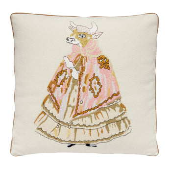 A NEEDLEPOINT CUSHION OF A COW IN A DRESS INSPIRED BY NANCY LANCASTER'S TABLECLOTH