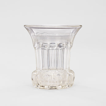 A CUT GLASS CELERY VASE WITH FLARED RIM, FACETTED SIDES AND HEAVY BULBOUS BASE.