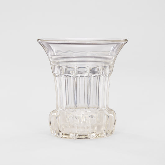 A CUT GLASS CELERY VASE WITH FLARED RIM, FACETTED SIDES AND HEAVY BULBOUS BASE.